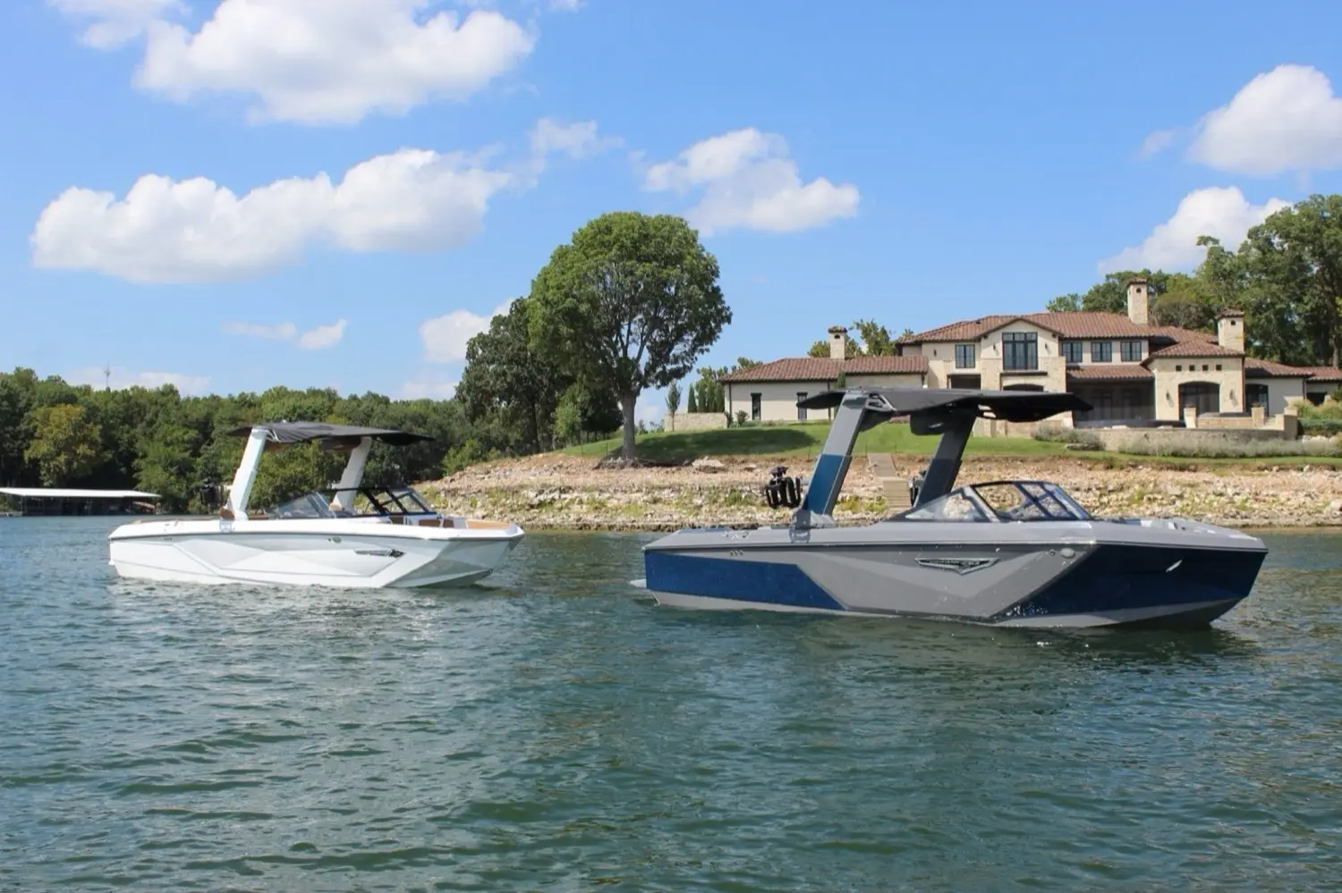 Pardo Endurance 60 cruising past a lake-house dock on Lake Eufaula
